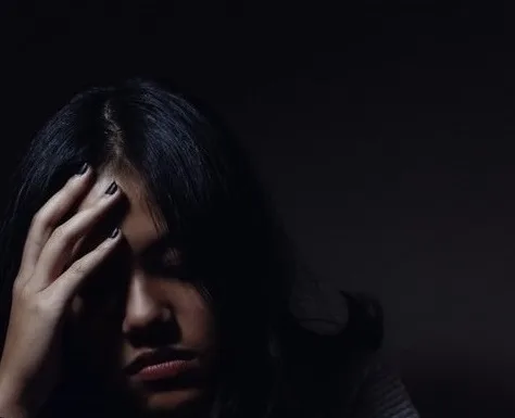 Photo of a woman with a headache