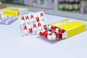 lupus and antimalarials - white and red medication pill blister pack